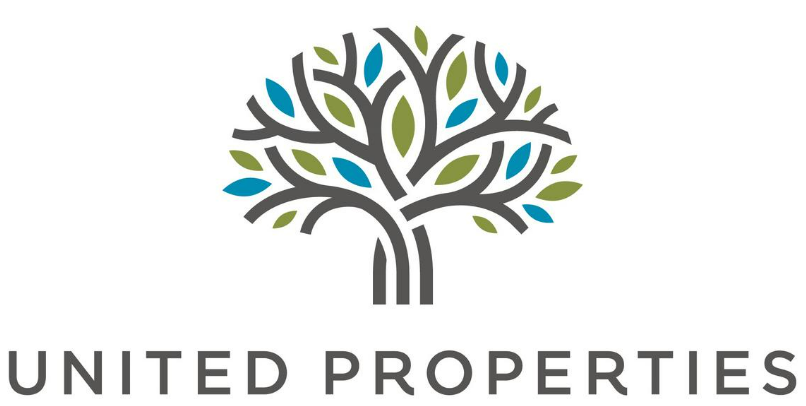 The logo for united properties has a tree with leaves on it.