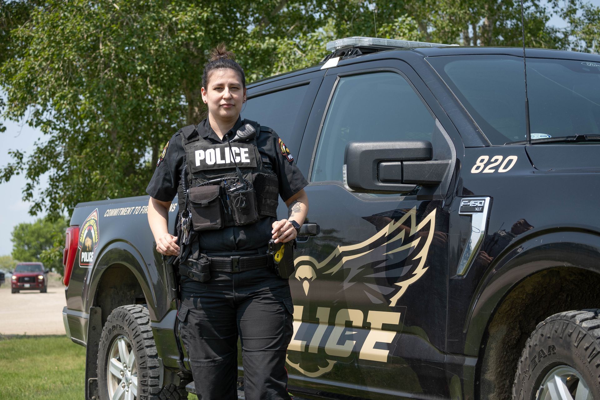 MFNPS-Manitoba First Nations Police Service - Female Officer with Police Vehicle