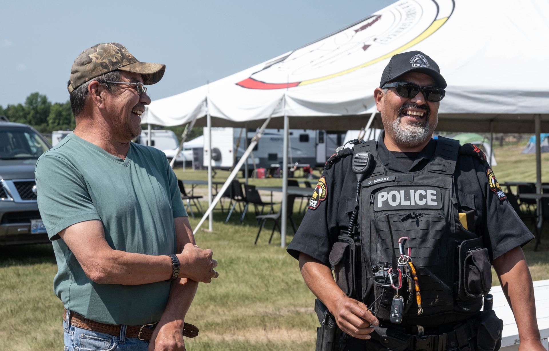MFNPS-Manitoba First Nations Police Service Officer with community member