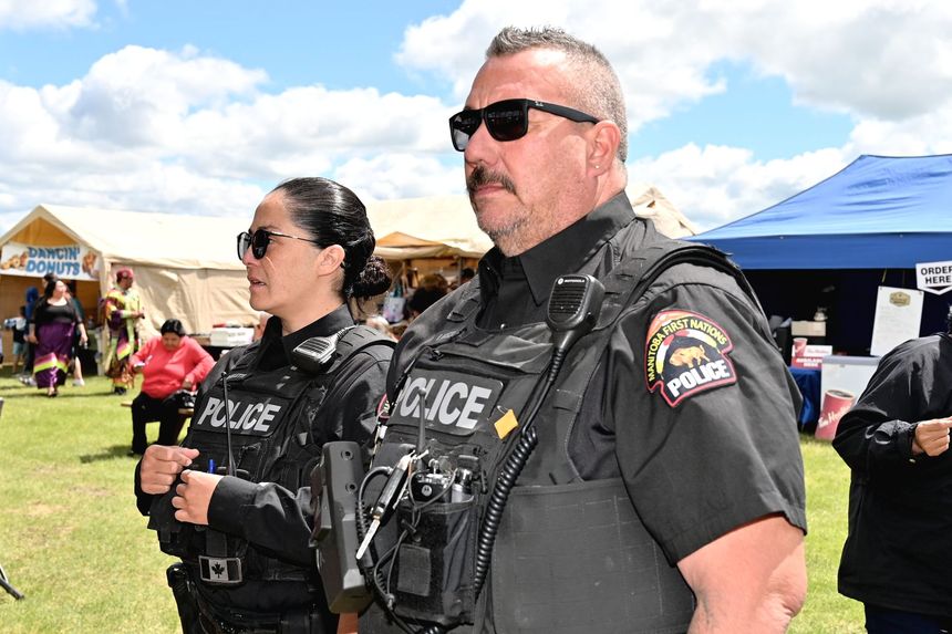 MFNPS-Manitoba First Nations Police Service - Two officers standing with Police cruiser