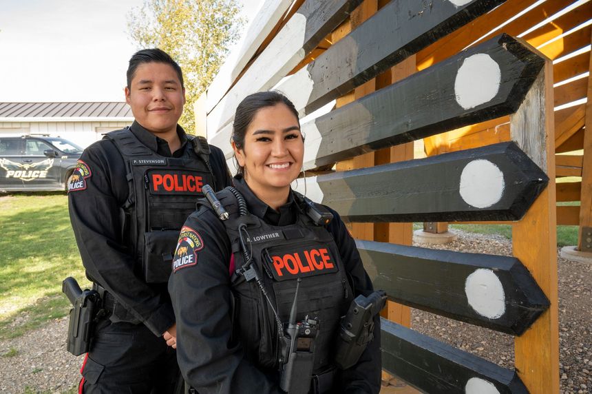 MFNPS-Manitoba First Nations Police Service - Two officers standing with Police cruiser