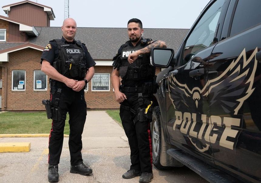 MFNPS-Manitoba First Nations Police Service - Two officers standing with Police cruiser