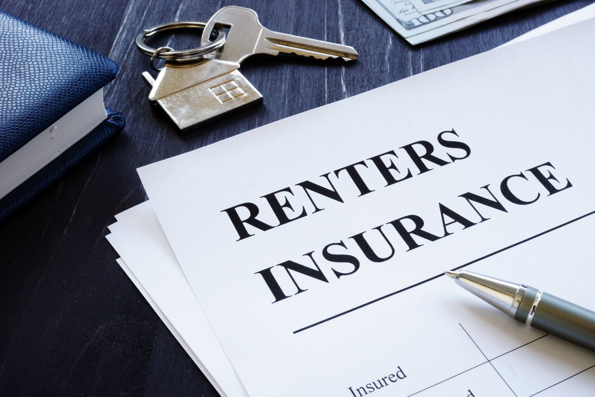 renters insurance contract with house key