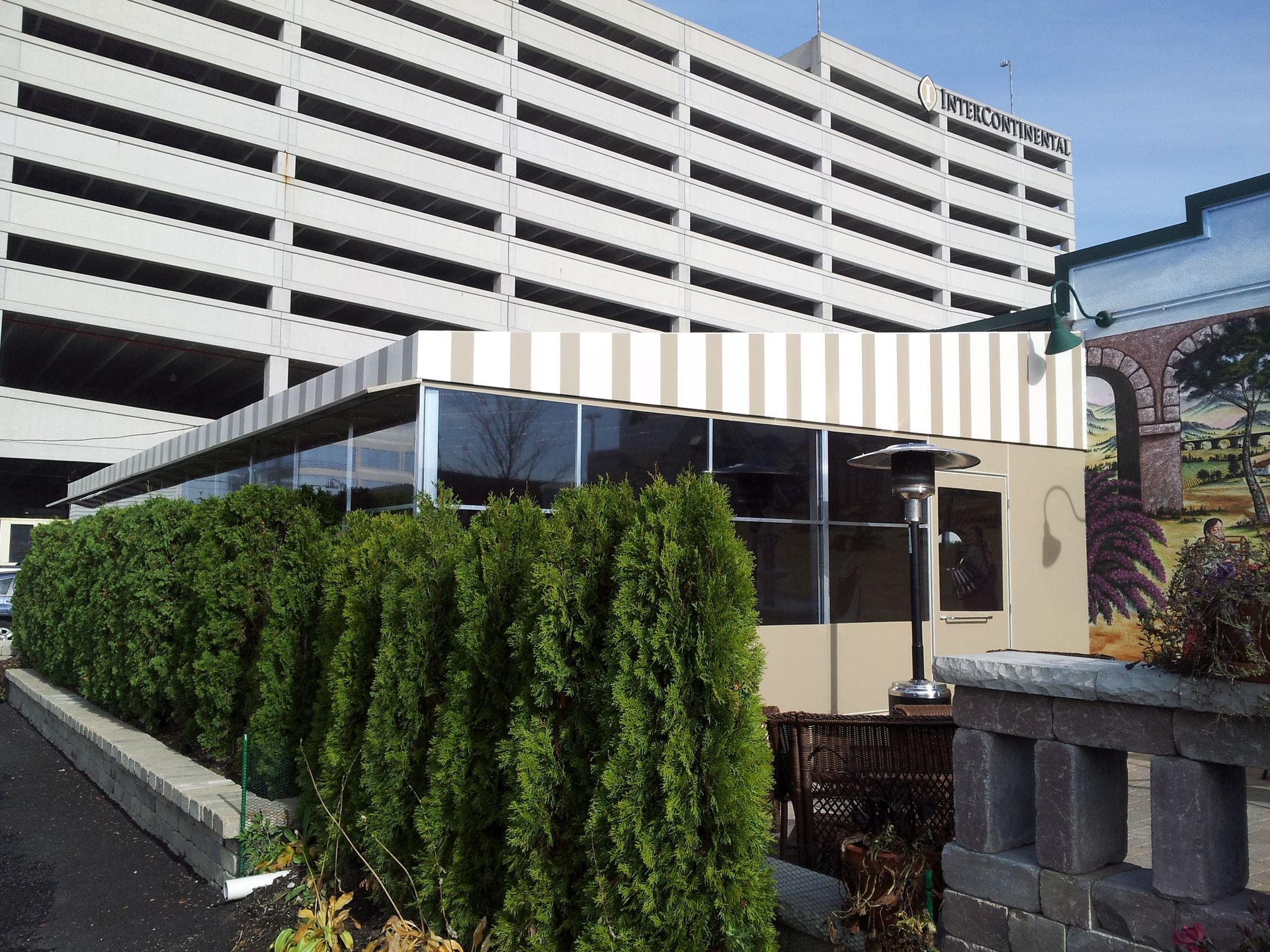 A building with a striped awning on top of it