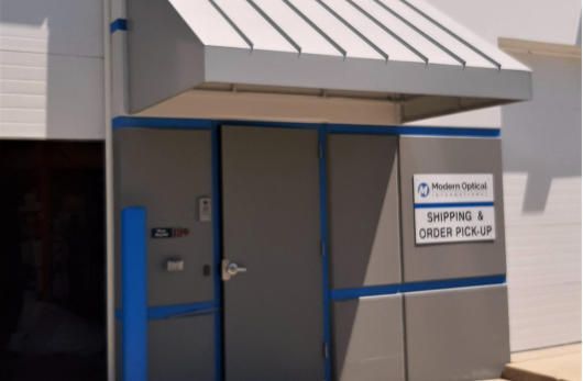 A building with a sign that says shipping and order pick up