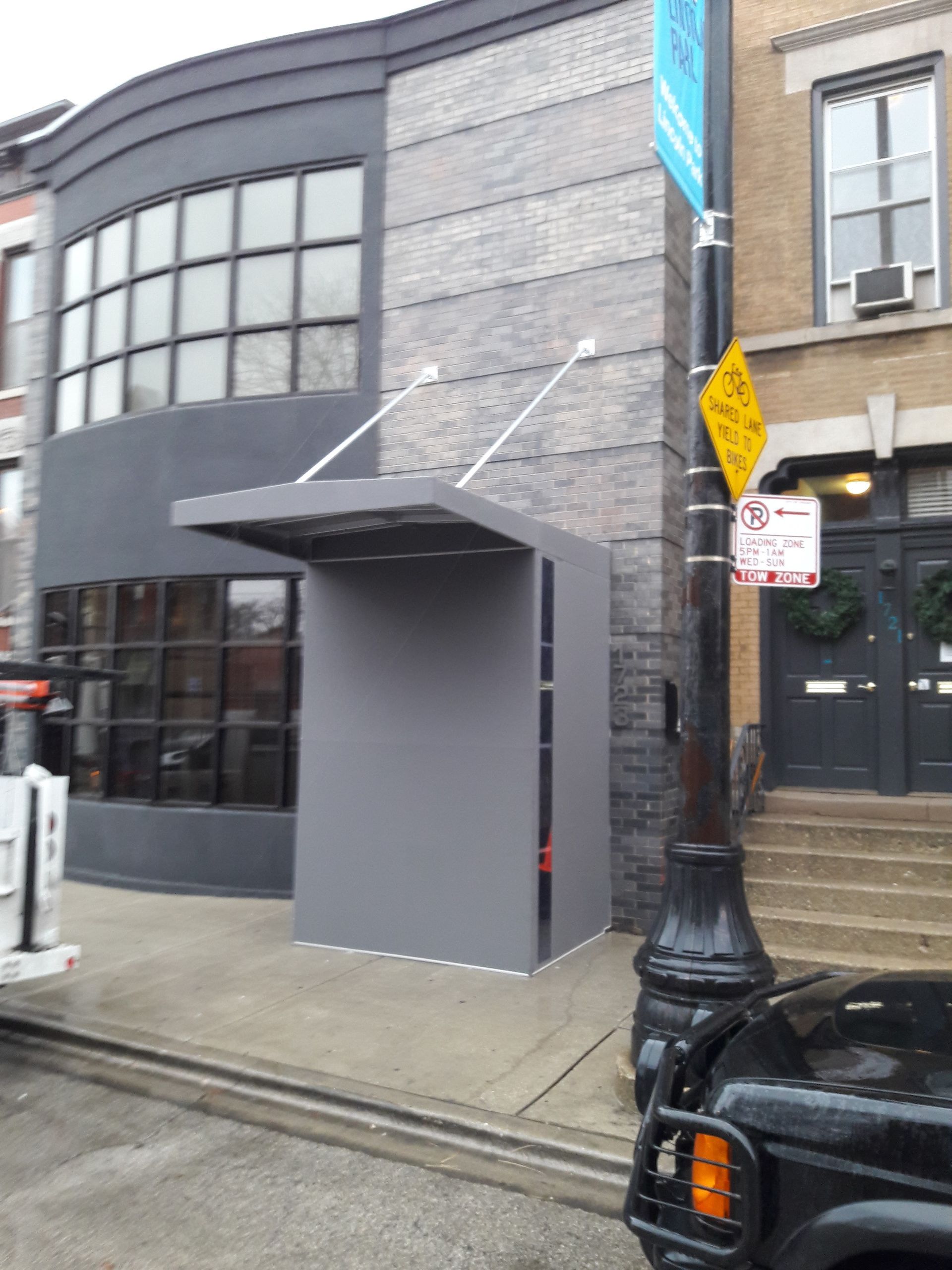 A building with a no parking sign in front of it