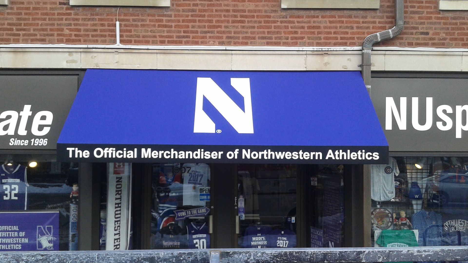 The official merchandiser of northwestern athletics has a blue awning