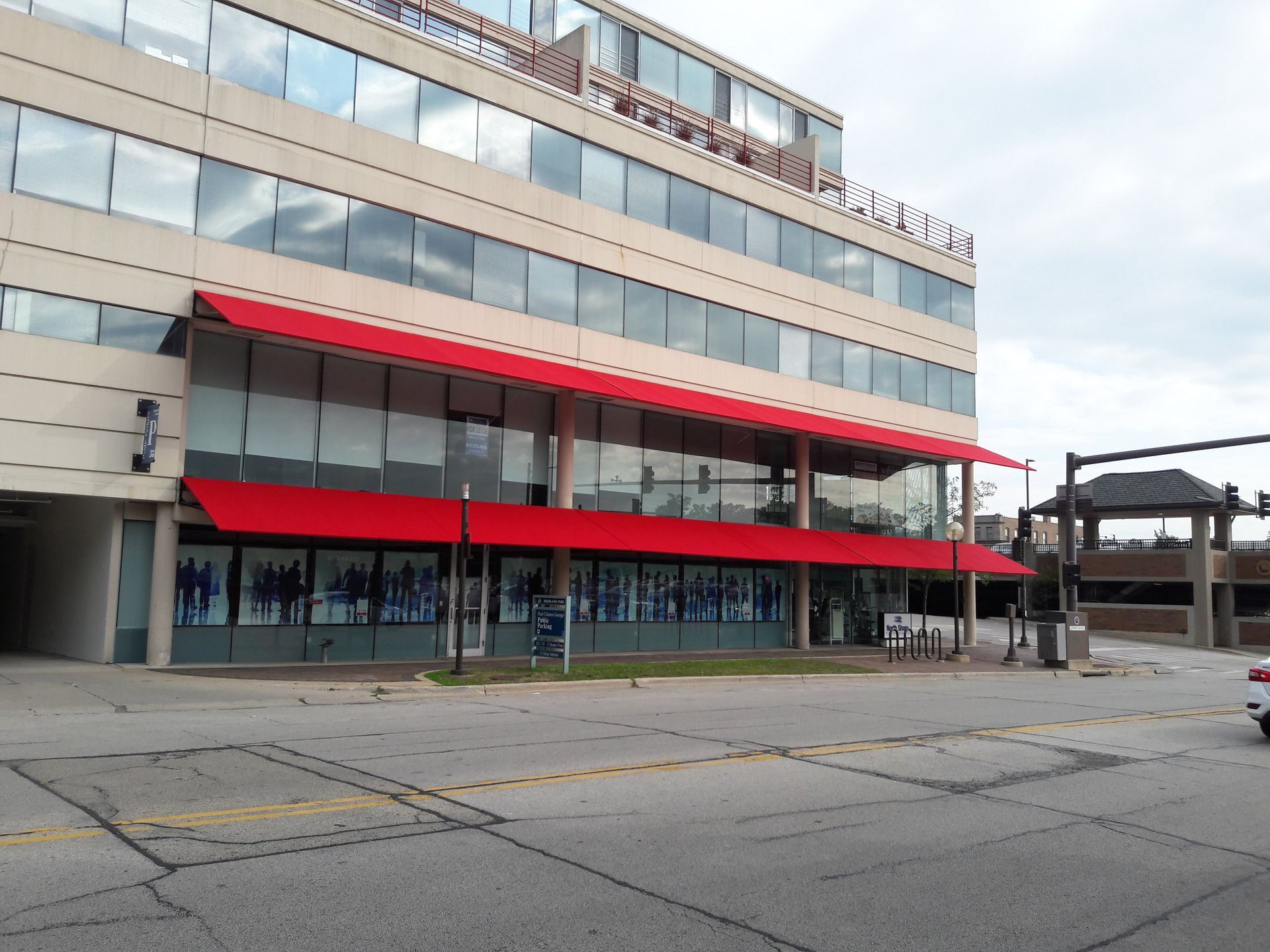 A large building with a red awning on the side of it
