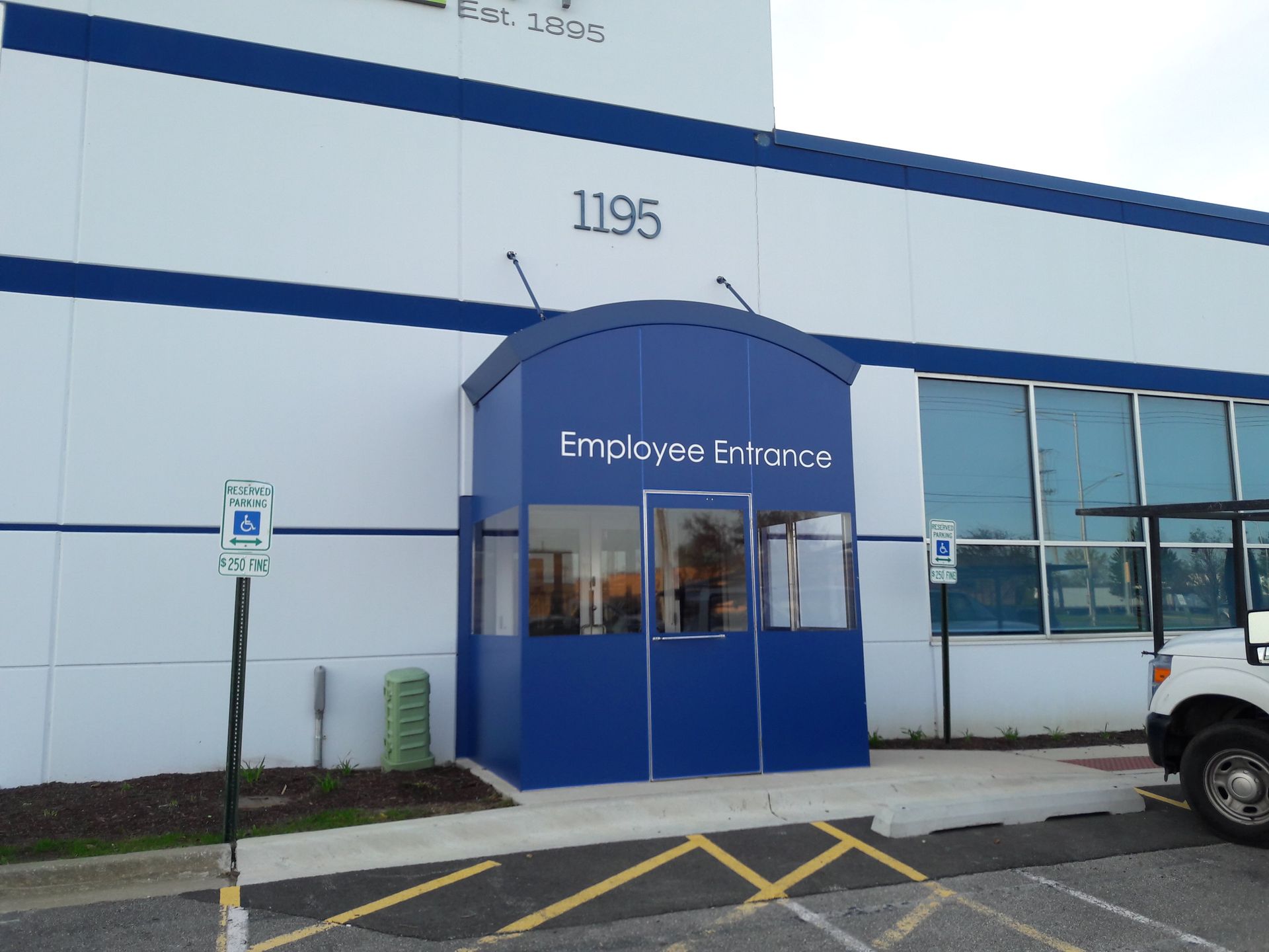 A blue and white building with the number 1195 on it