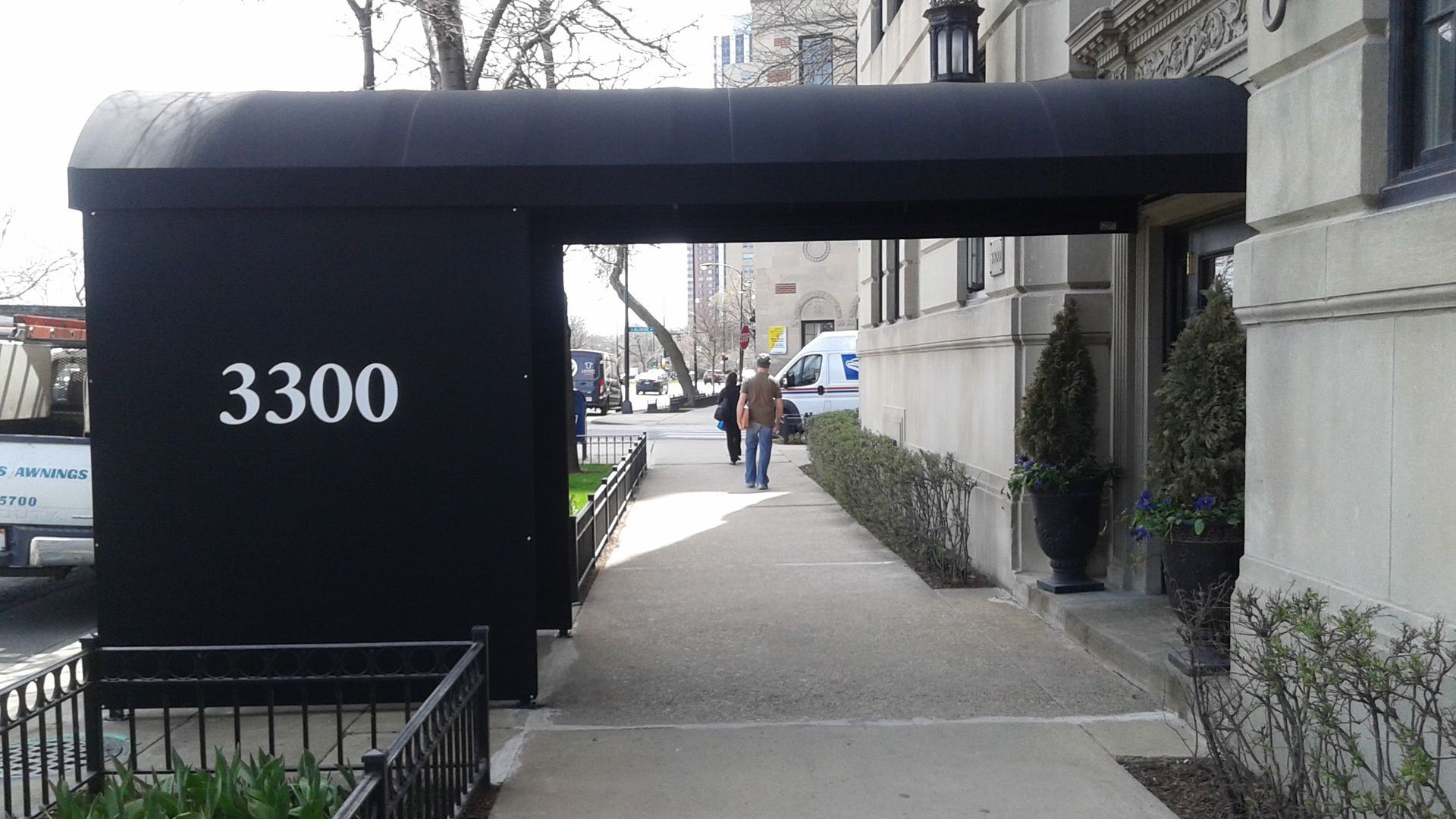 A black awning with the number 3300 on it