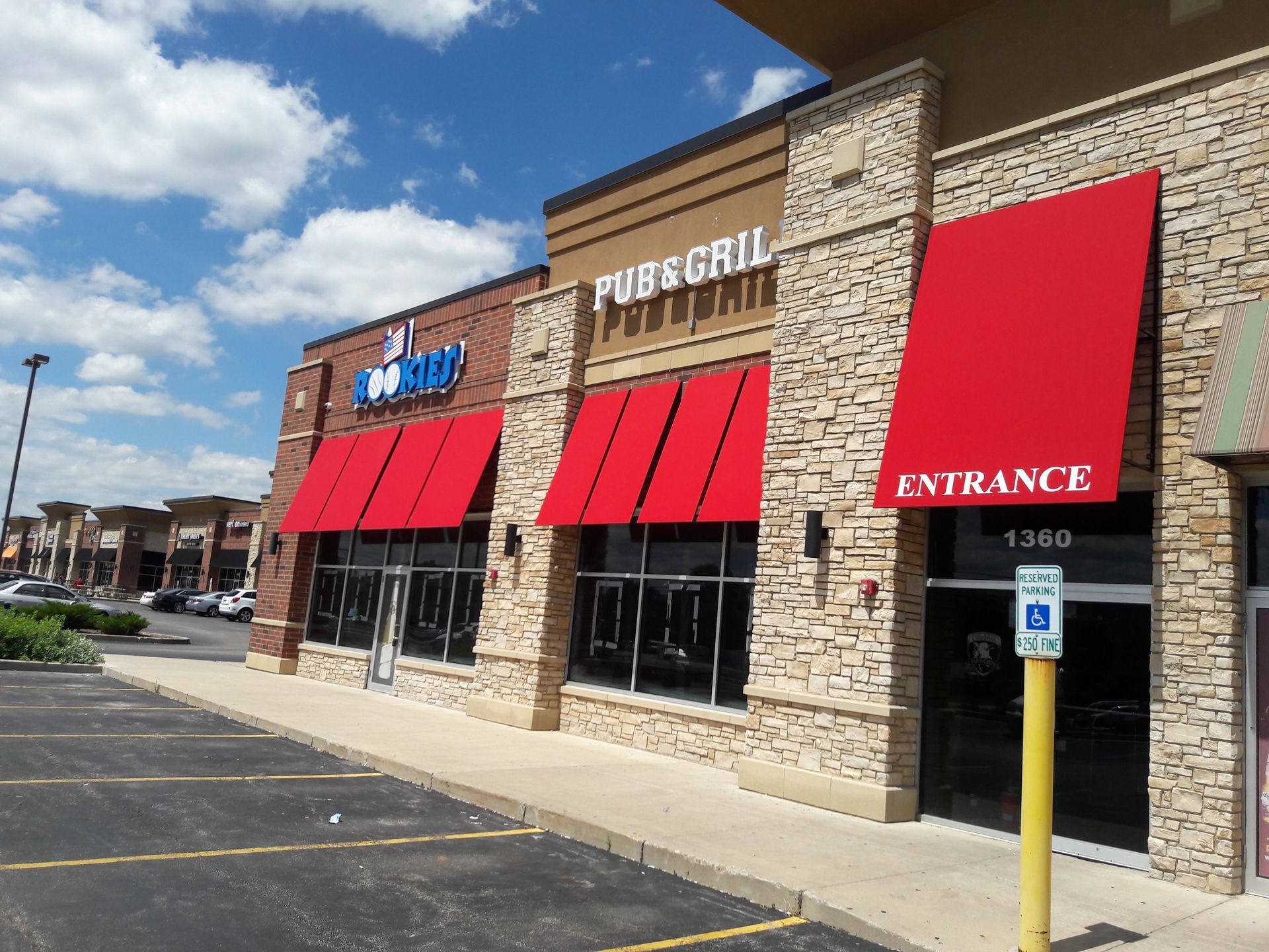 A red awning with the word entrance on it