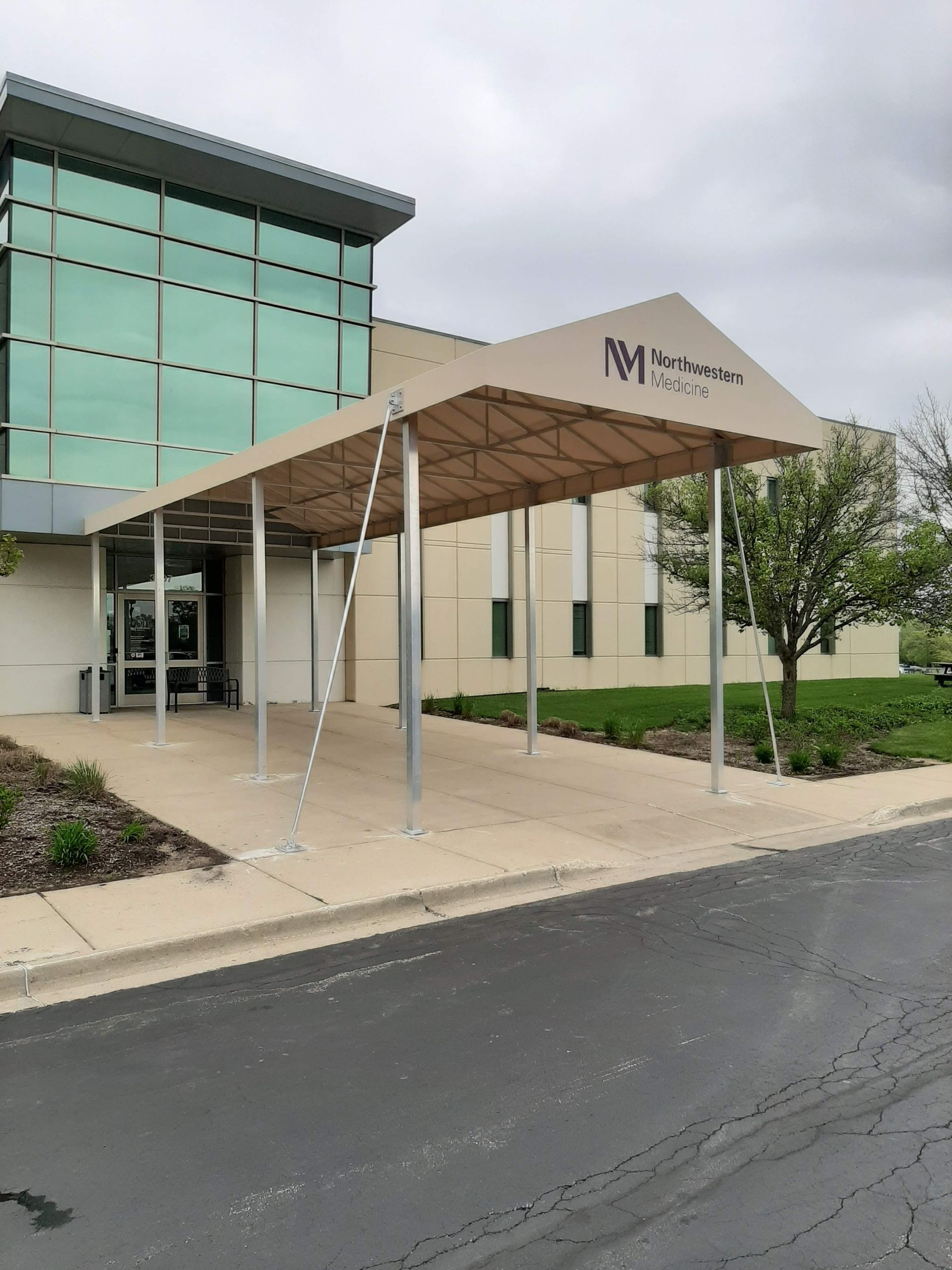 A large building with a canopy over the entrance