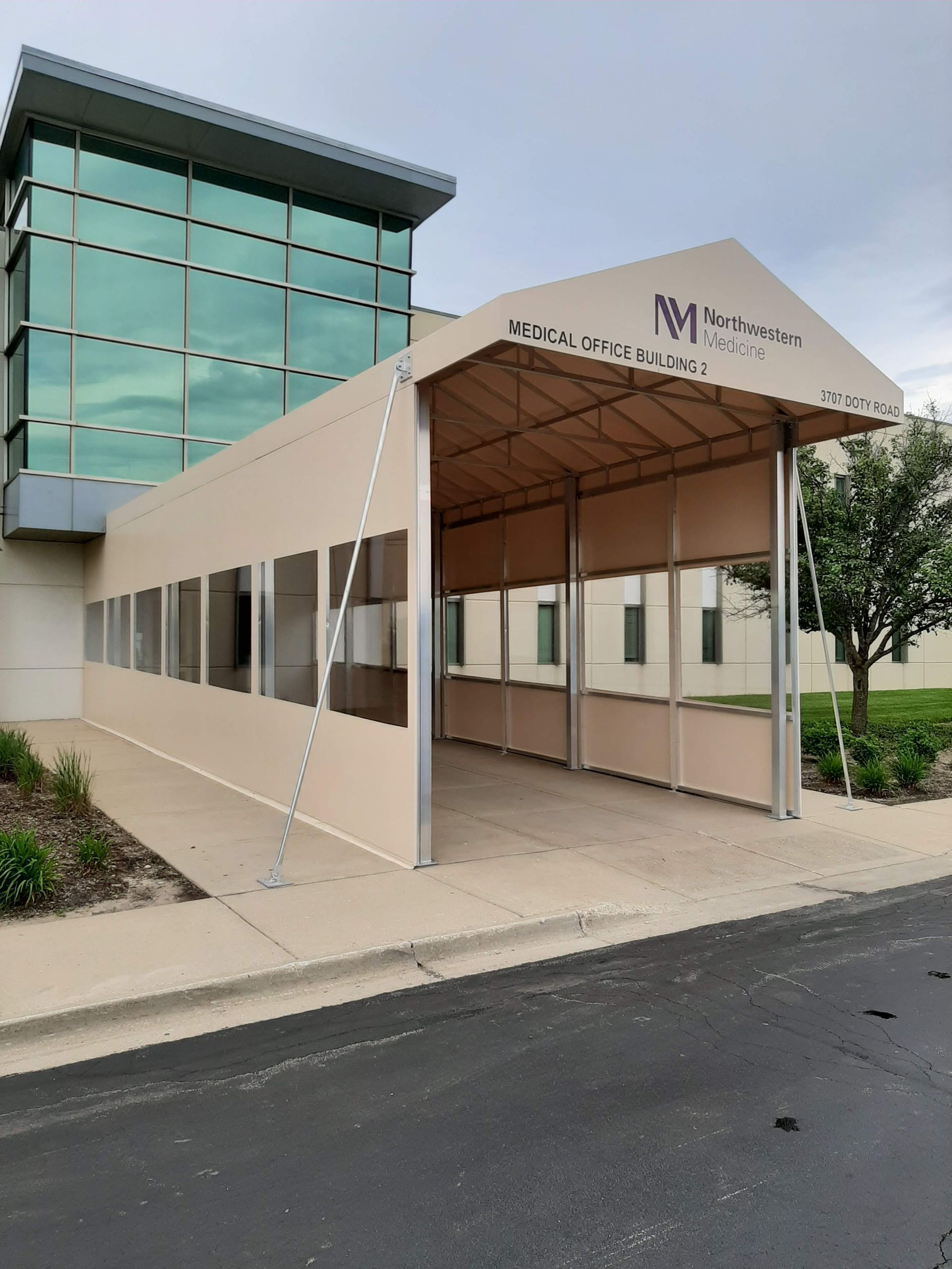 A large building with a covered walkway in front of it