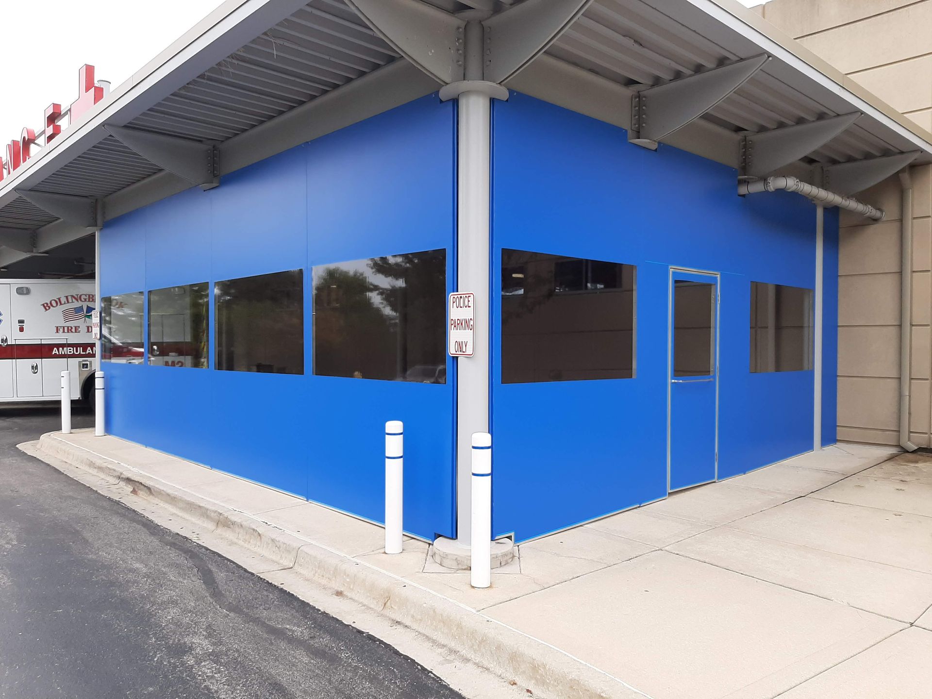 A blue building with a lot of windows and doors