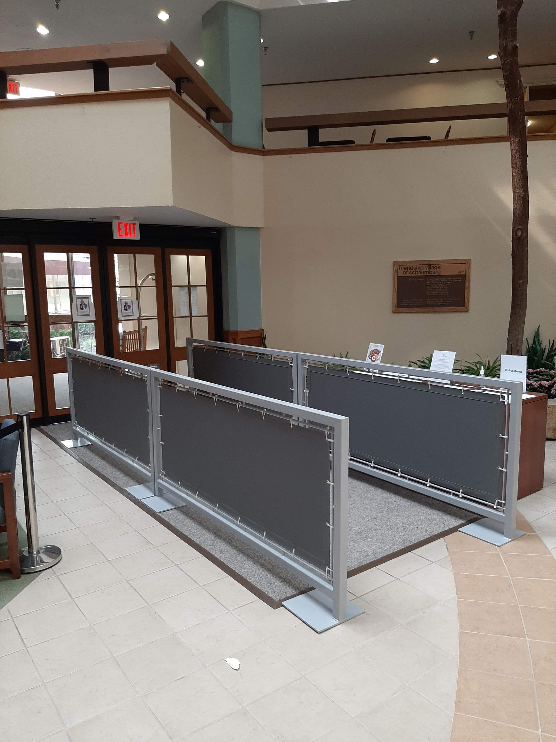 A handicapped ramp in a lobby of a building