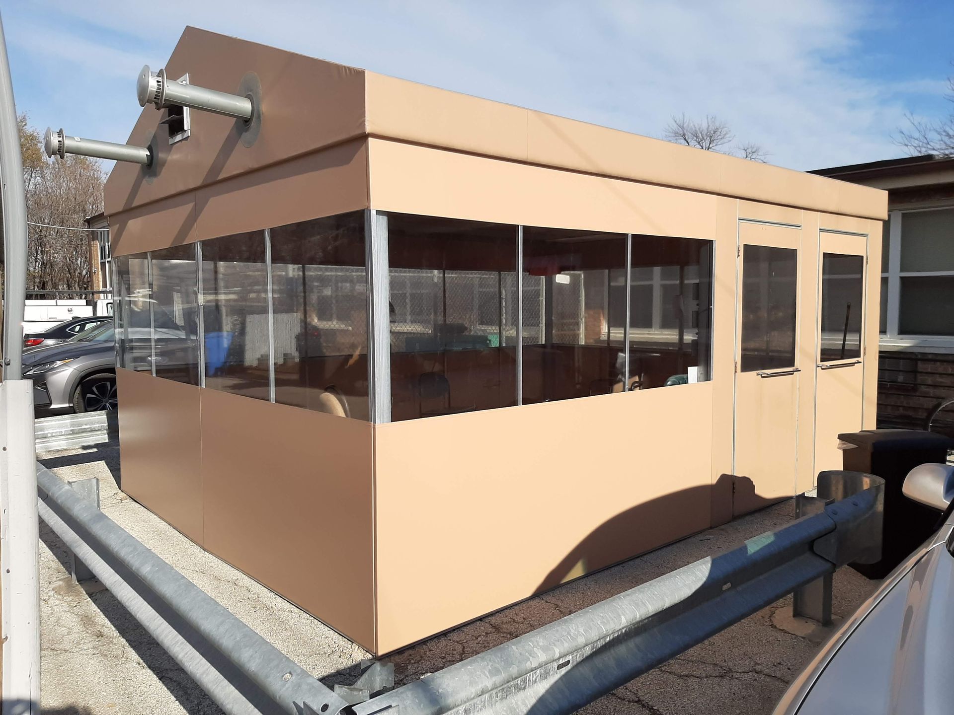 A building with a lot of windows and a fence around it