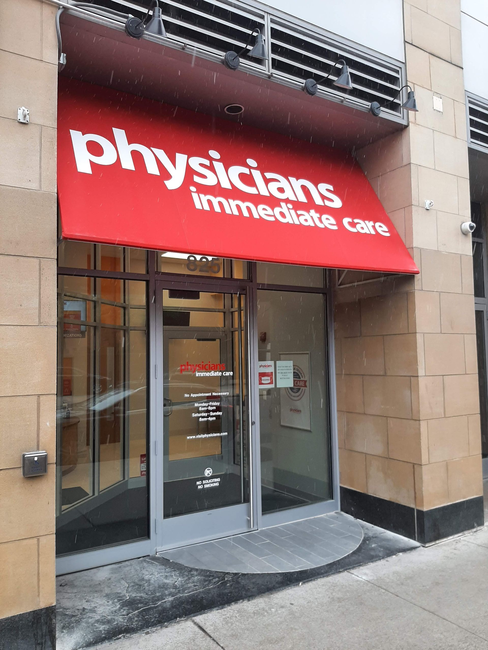 A physicians immediate care store front with a red awning