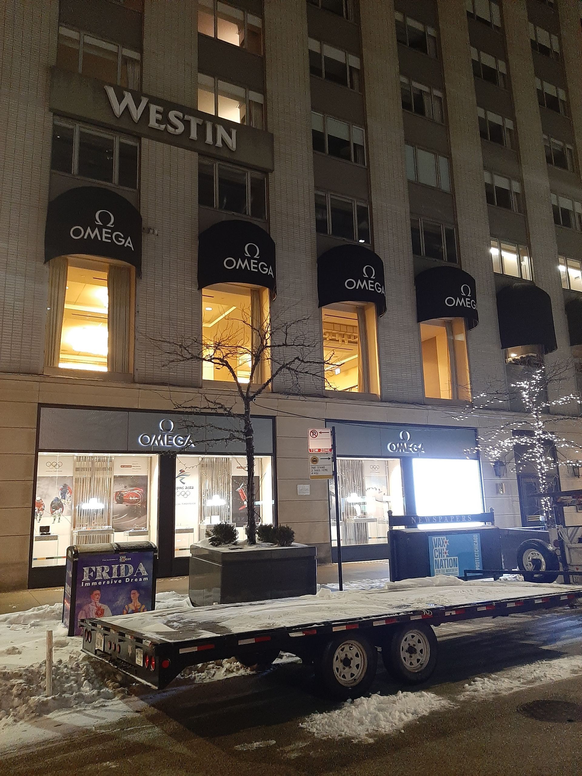 A trailer is parked in front of a building that says westin