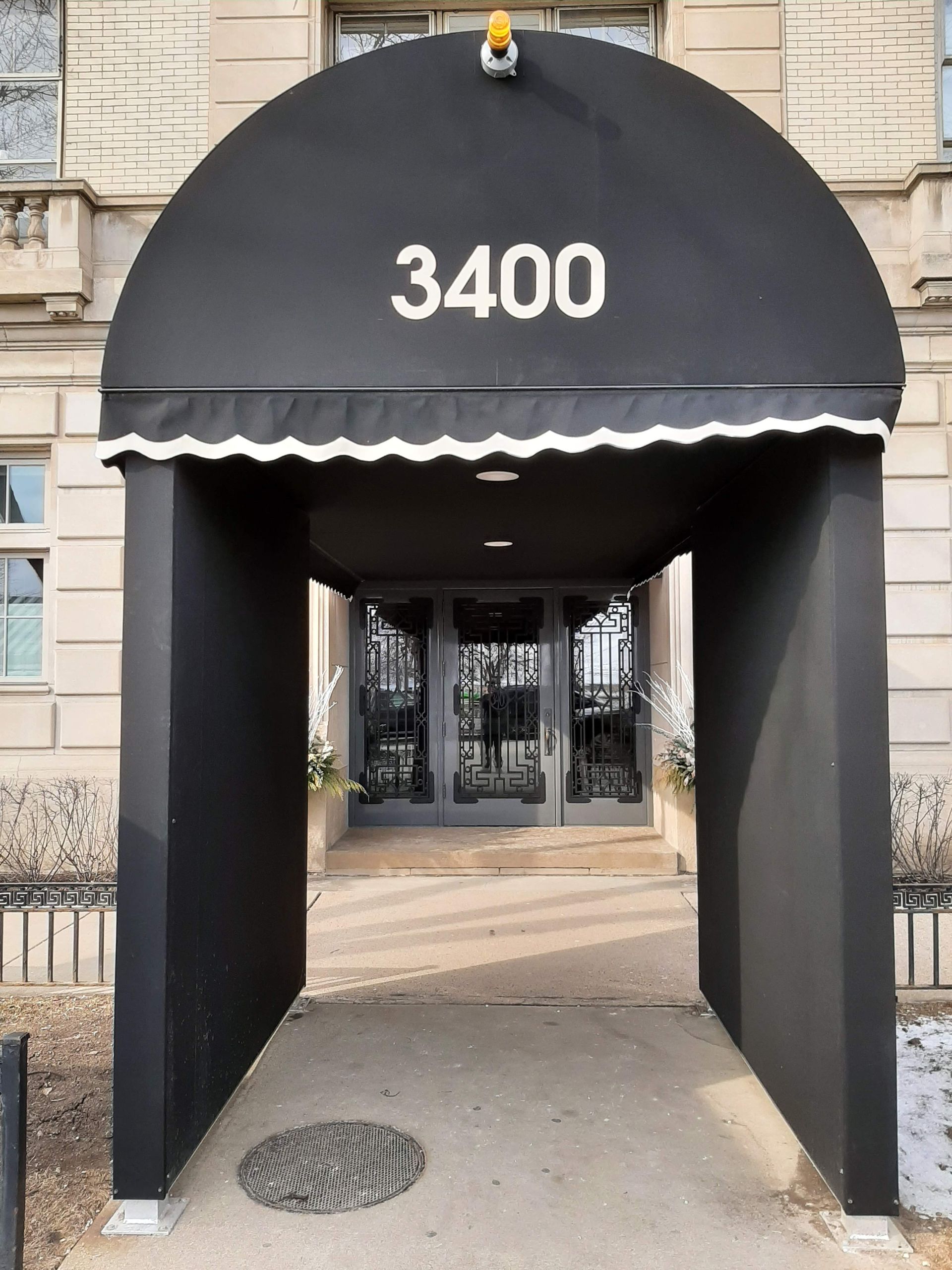 A black awning with the number 3400 on it