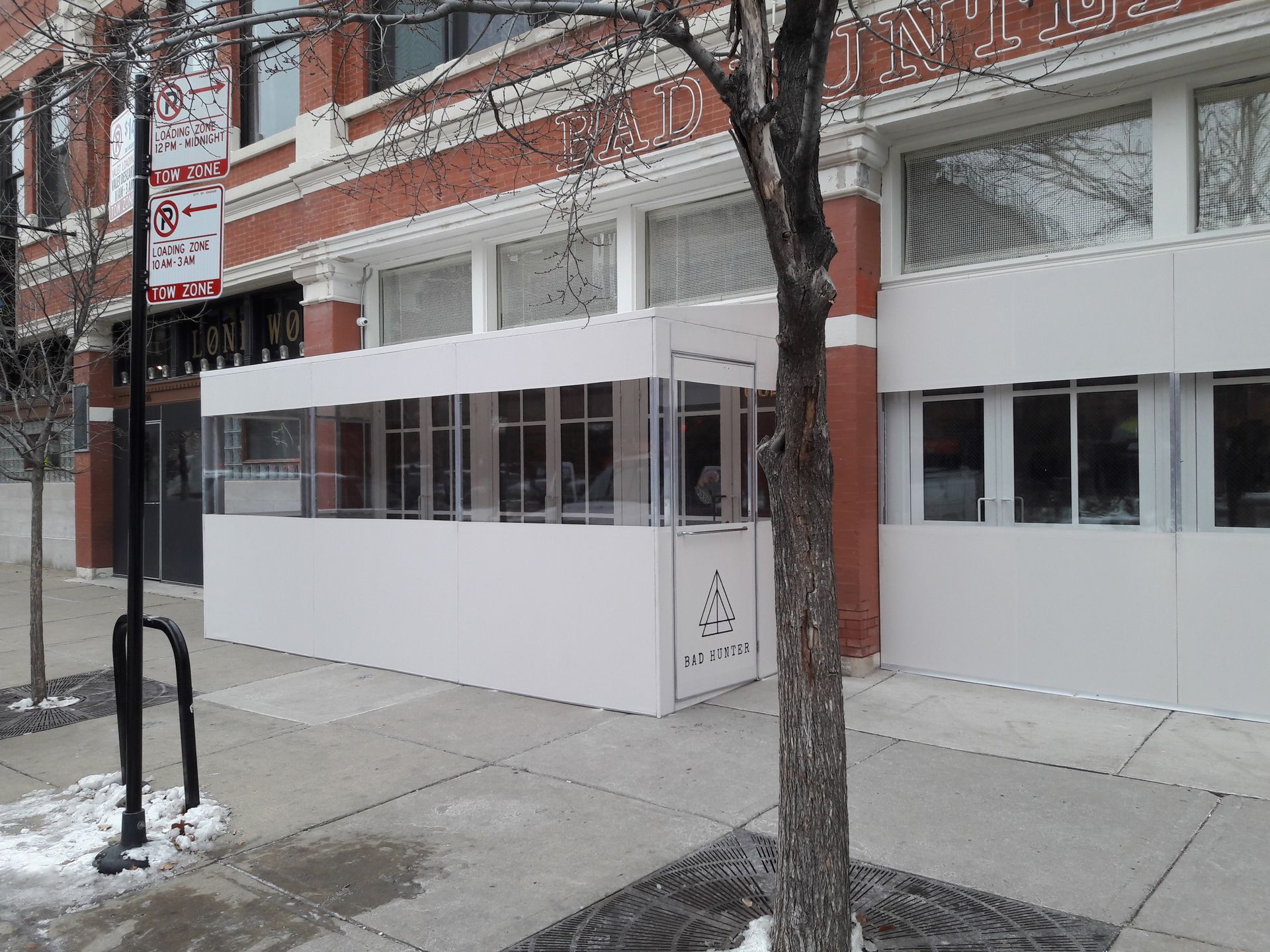 A building with a no parking sign in front of it