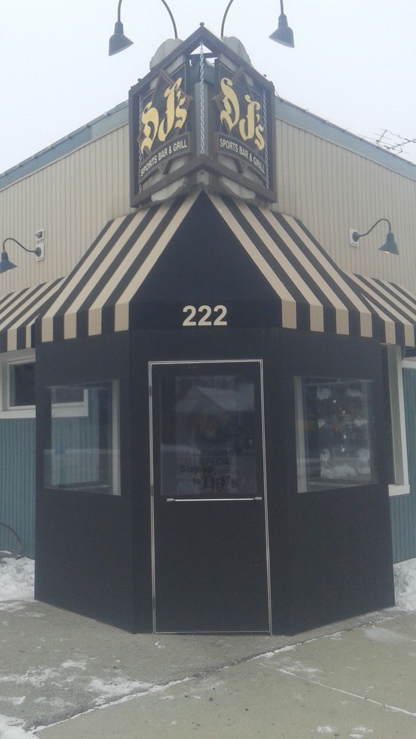 A building with a striped awning and the number 222 on it
