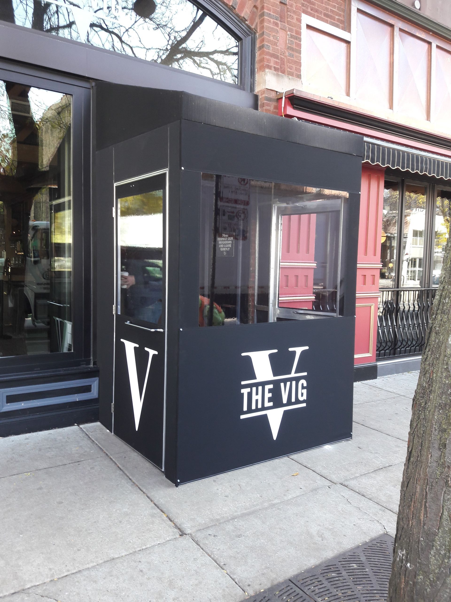 A black building with the word the vig on it