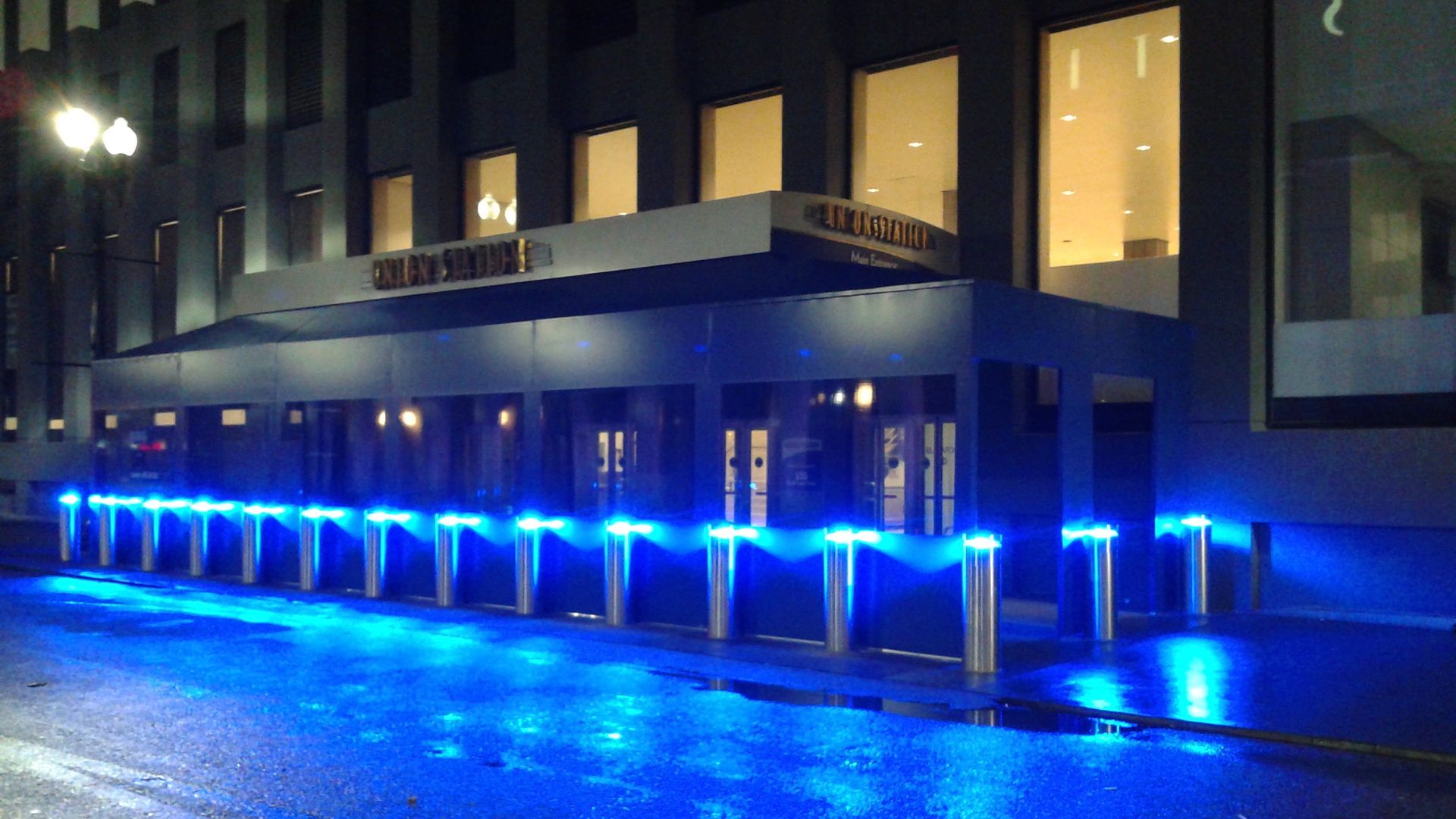 A building with blue lights on the side of it