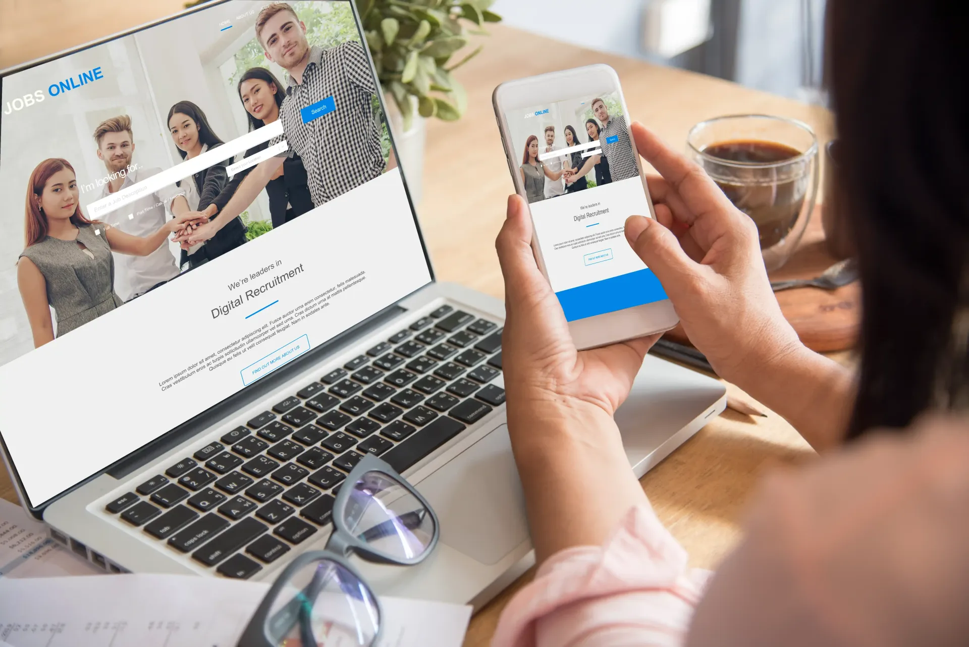 Woman using a laptop and smartphone, both displaying the same website to check on user experience for SEO.