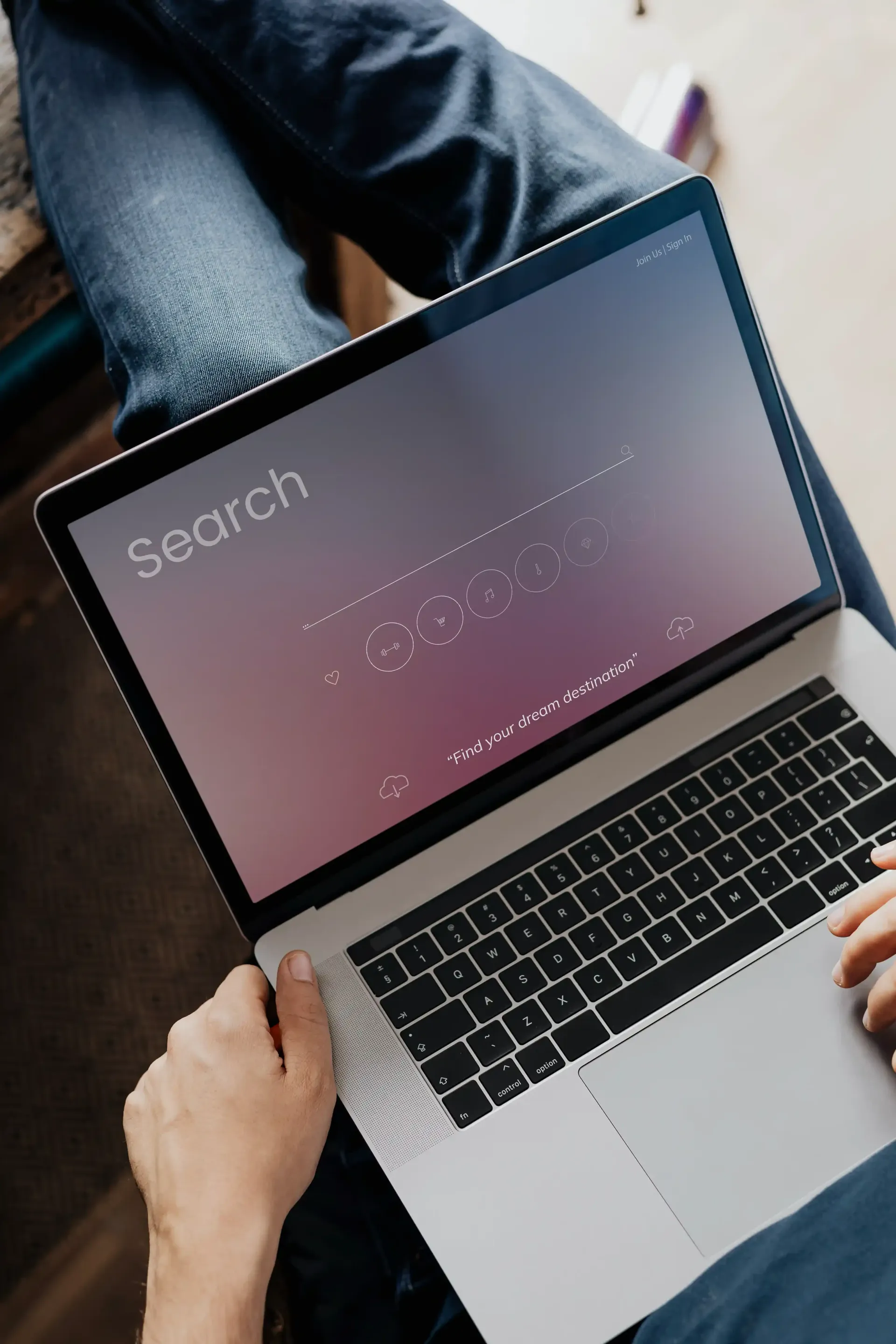 Person using laptop, search browser pulled up on their screen for research on SEO agency costs.