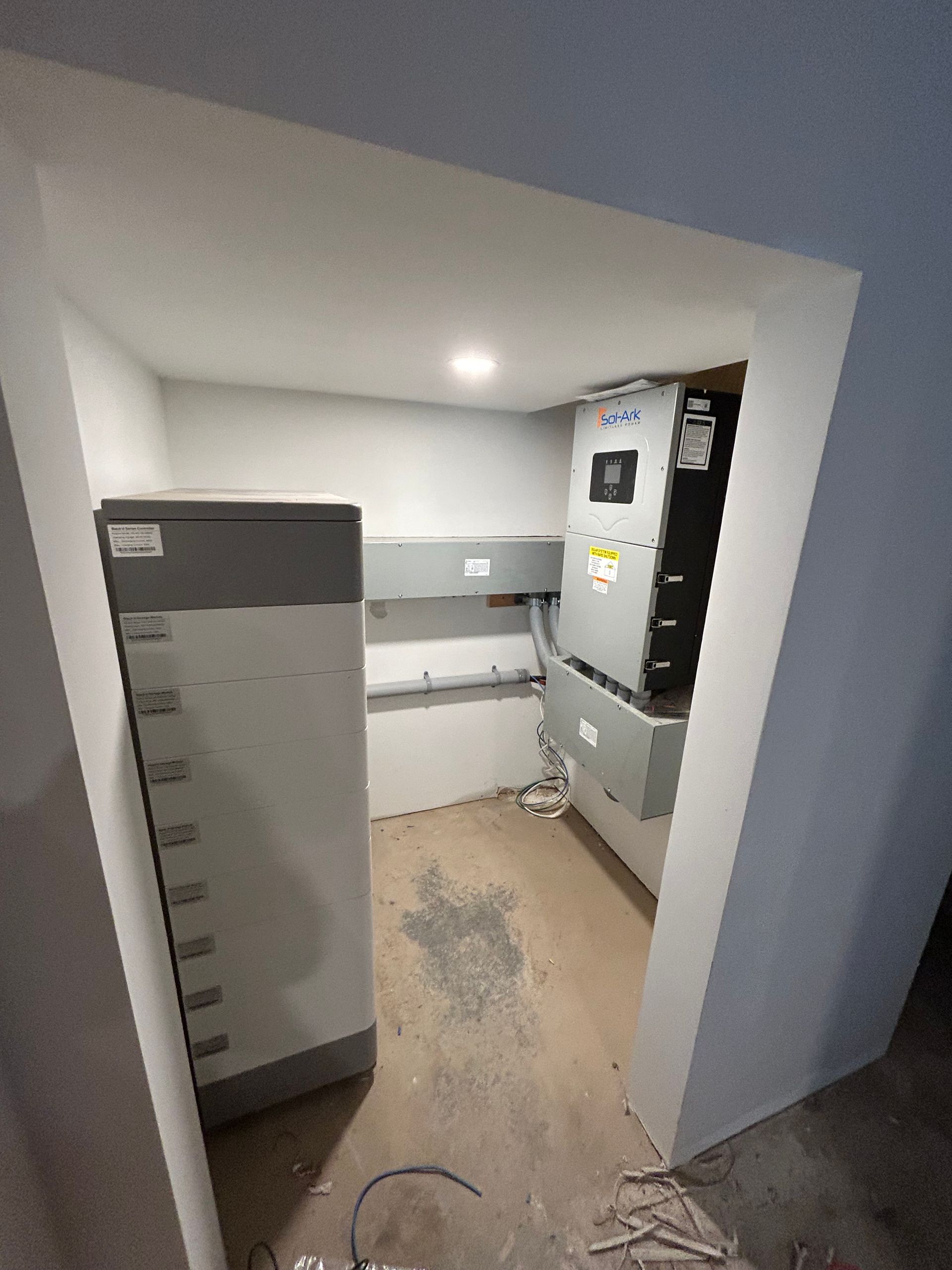 A room with a lot of electrical equipment in it.