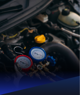 Automotive air conditioning manifold gauge set attached to an engine bay for maintenance and testing. | Heaven Sent Automotive