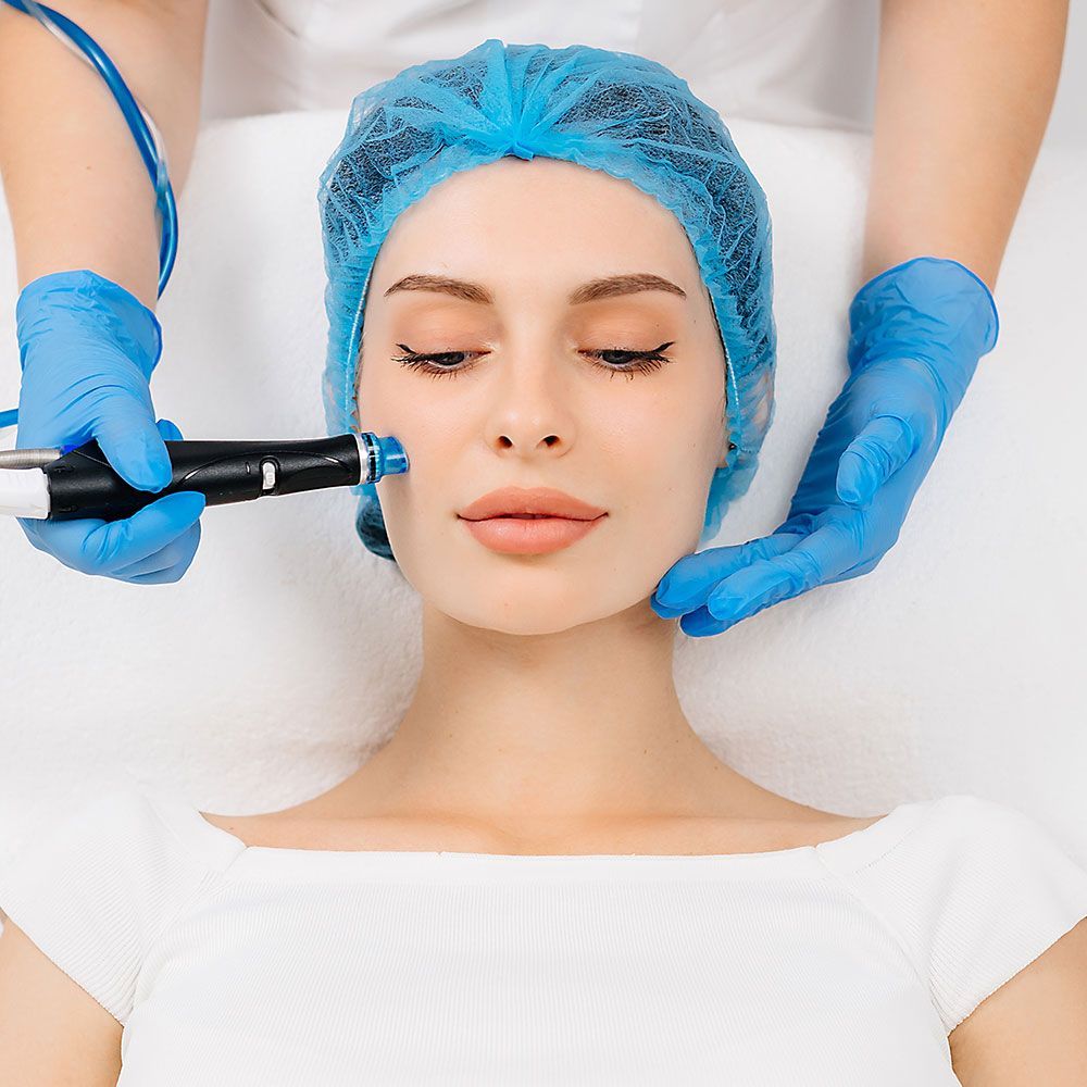 Woman wearing Hair Cap for Hydrafacial Session