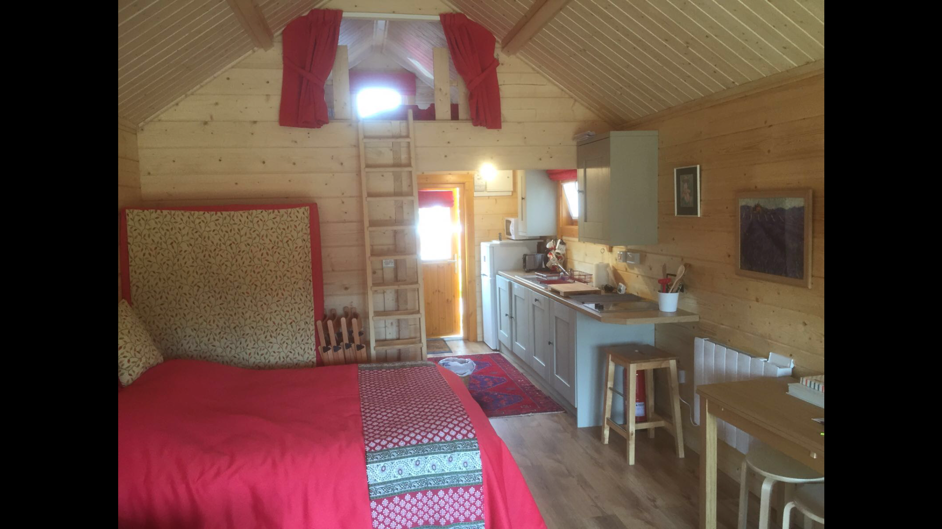 double bedroom in a log cabin