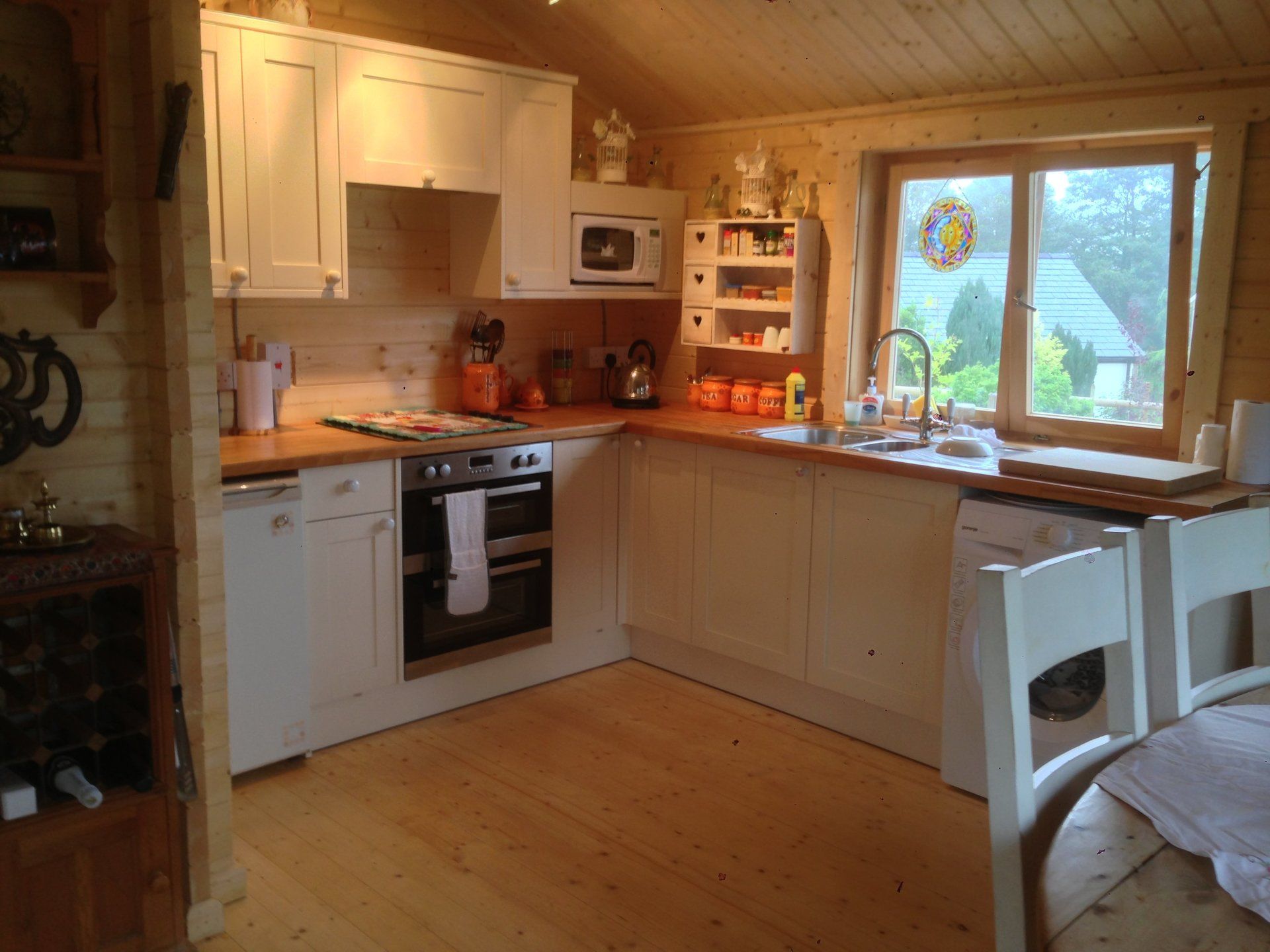 white kitchen area in a garden home