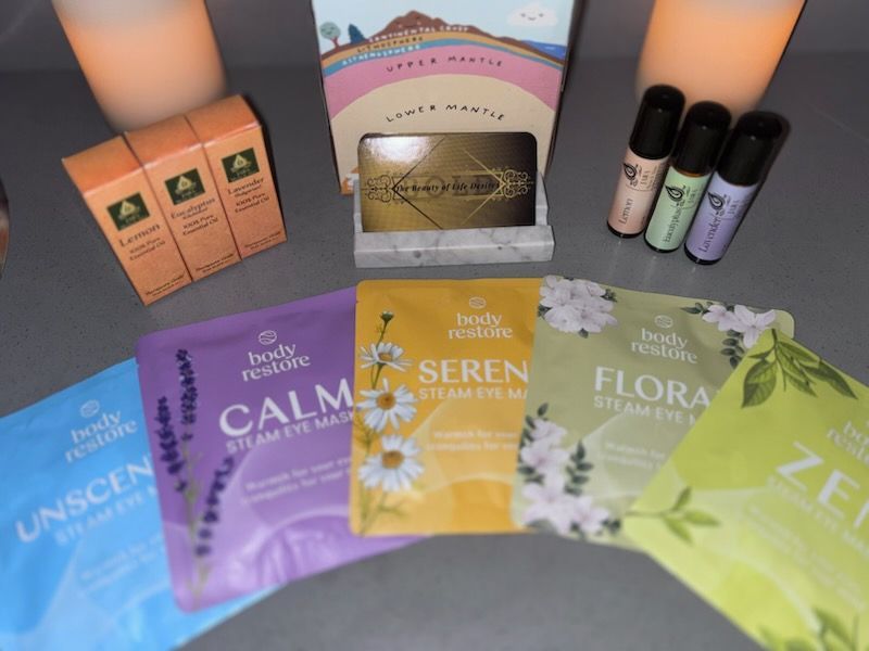 A variety of body restore products are sitting on a table.