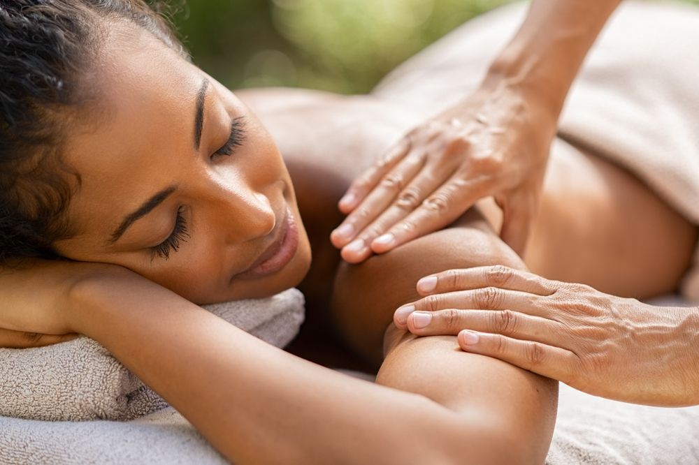 A woman is getting a massage at a spa.