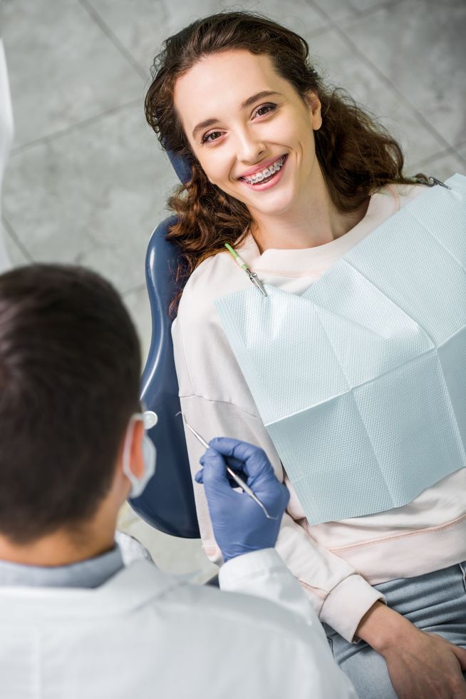Dr. Blaine Leeds DDS Dental Dentist Woman Patient Smiling in chair