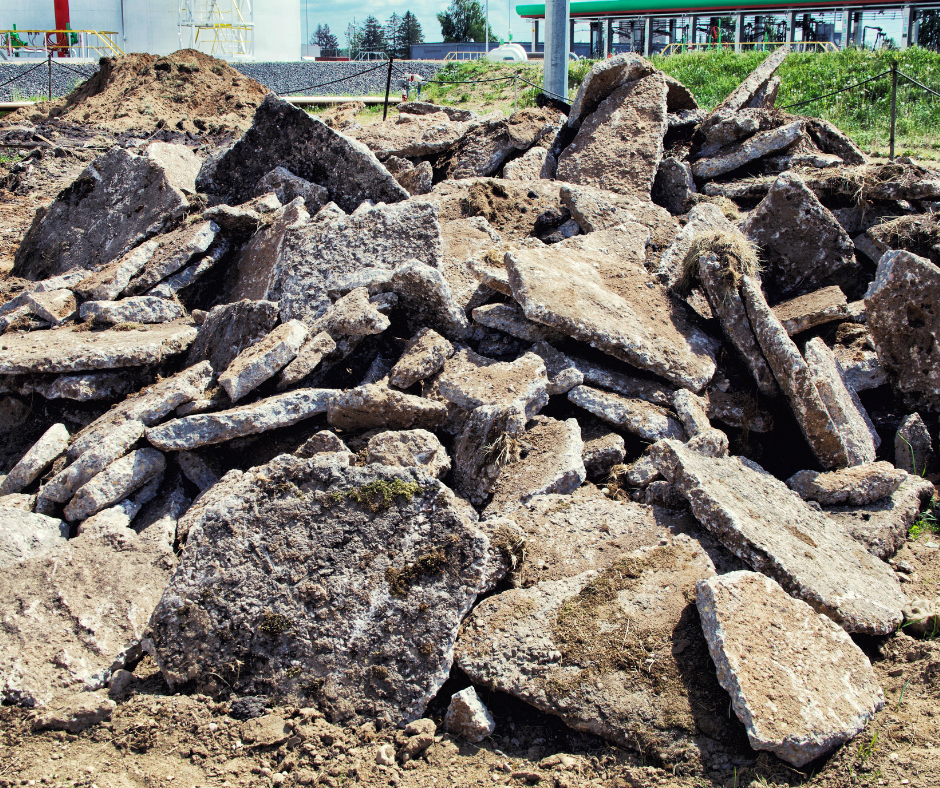 A pile of rocks and dirt in a field