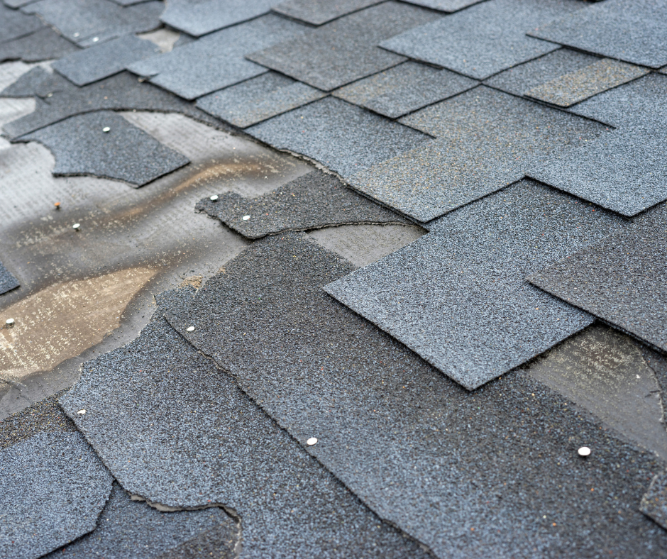 A close up of a roof with a lot of shingles on it.