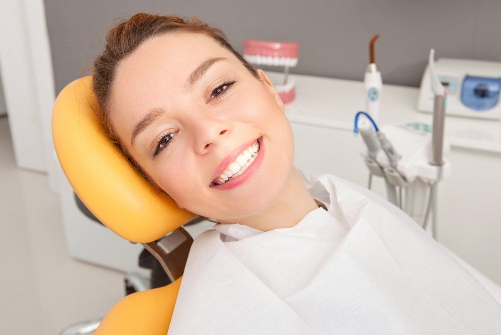 Smiling Woman Inside Dental Clinic — Lenoir, NC — Wayne Hollar DDS