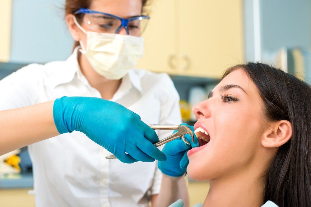 Extracting Tooth From Patient — Lenoir, NC — Wayne Hollar DDS