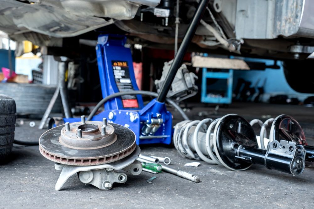 A Brake Disc and Suspension Coil — Norm Beatty's Auto Electrical Service In Long Jetty, NSW