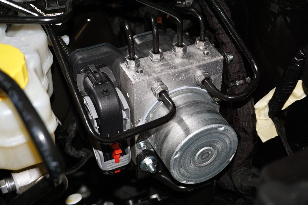 ABS Module With Visible Hydraulic Lines and Connectors — Norm Beatty's Auto Electrical Service In Long Jetty, NSW