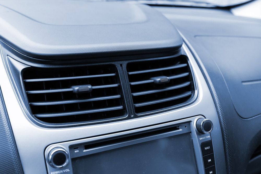 A Car Dashboard Featuring Air Vents and a Radio System — Norm Beatty's Auto Electrical Service In Long Jetty, NSW