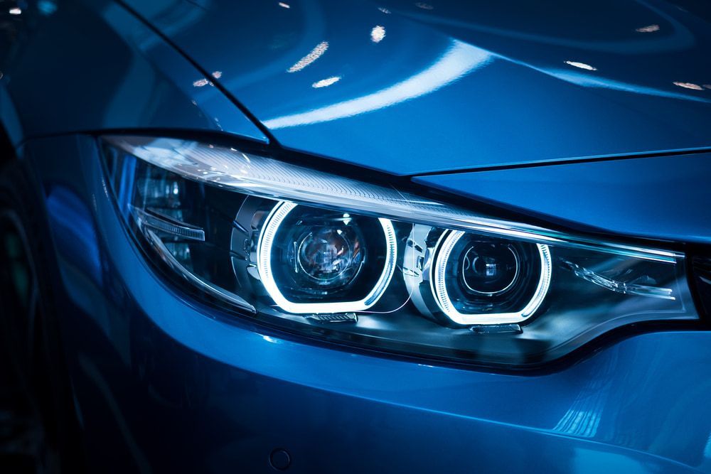 A Sleek Blue Car's Headlight — Norm Beatty's Auto Electrical Service In Long Jetty, NSW