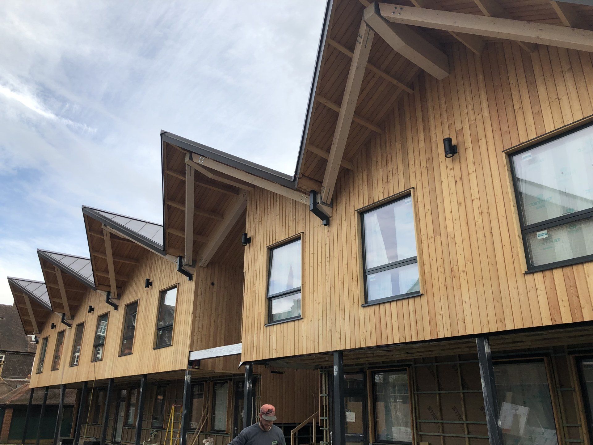 Cedar Cladding, Cranleigh Classrooms. Builder. Building contractor. Construction. Carpentry. Carpentry contractor. Extensions. New builds. Timber frame fabrication and erection. Design and build. Kitchen installations. Horsham. Surrey. Reigate. Redhill. Dorking. Crawley. West Sussex. Cranleigh.