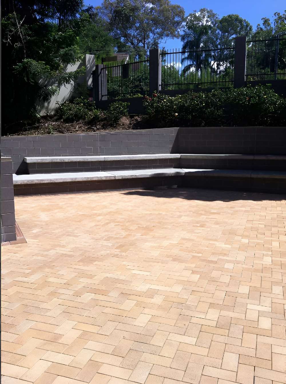 A Brick Walkway With Steps And A Fence In The Background — EcoPro Pressure Cleaning In Burleigh, QLD