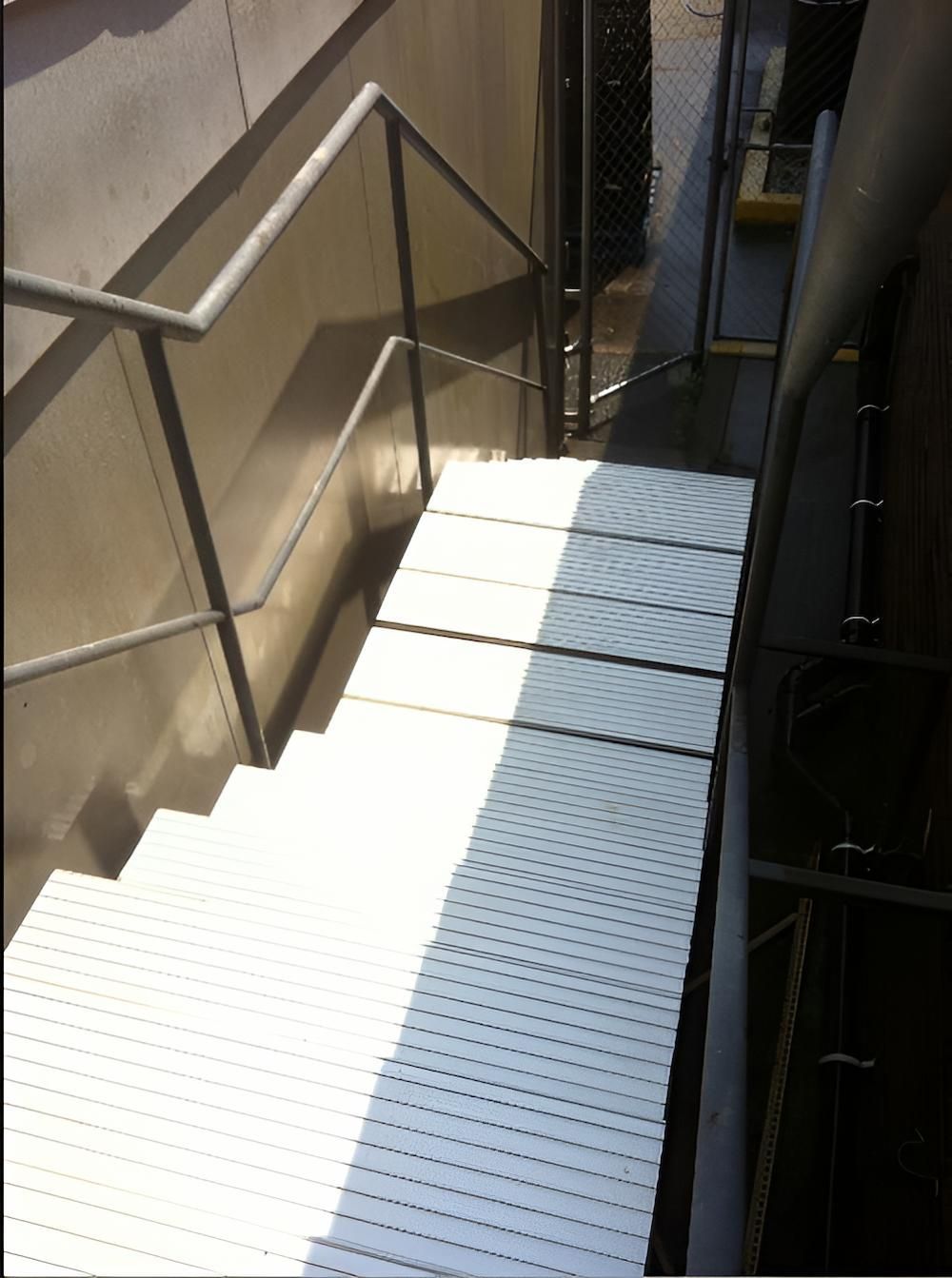 A Set Of White Stairs With A Metal Railing — EcoPro Pressure Cleaning In Nerang, QLD
