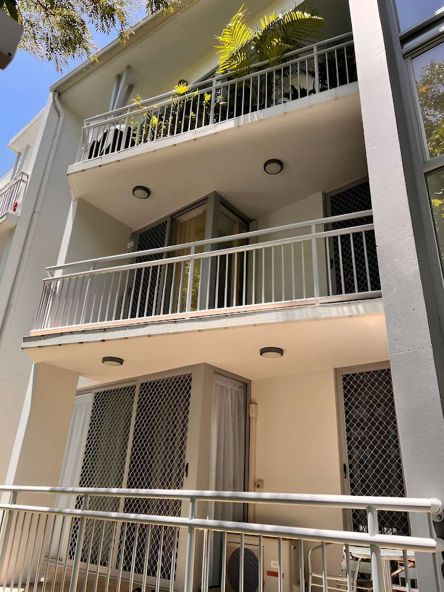A White Building With A Balcony And A Metal Railing — EcoPro Pressure Cleaning In Broadbeach Waters, QLD