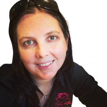 A woman wearing sunglasses and a shirt that says sn air